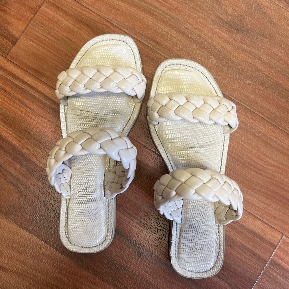 Well worn cream sandals